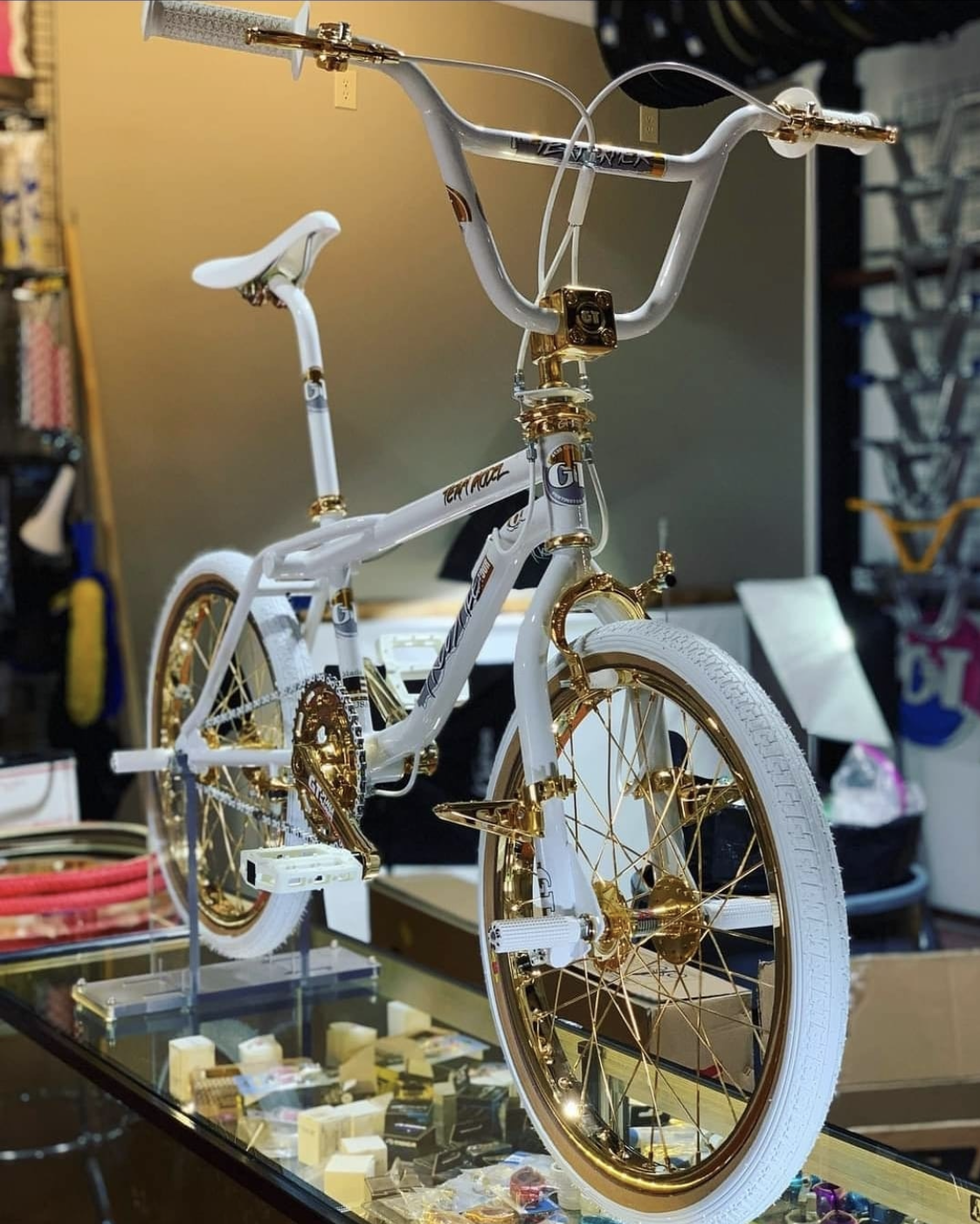 A white and gold customised BMX.